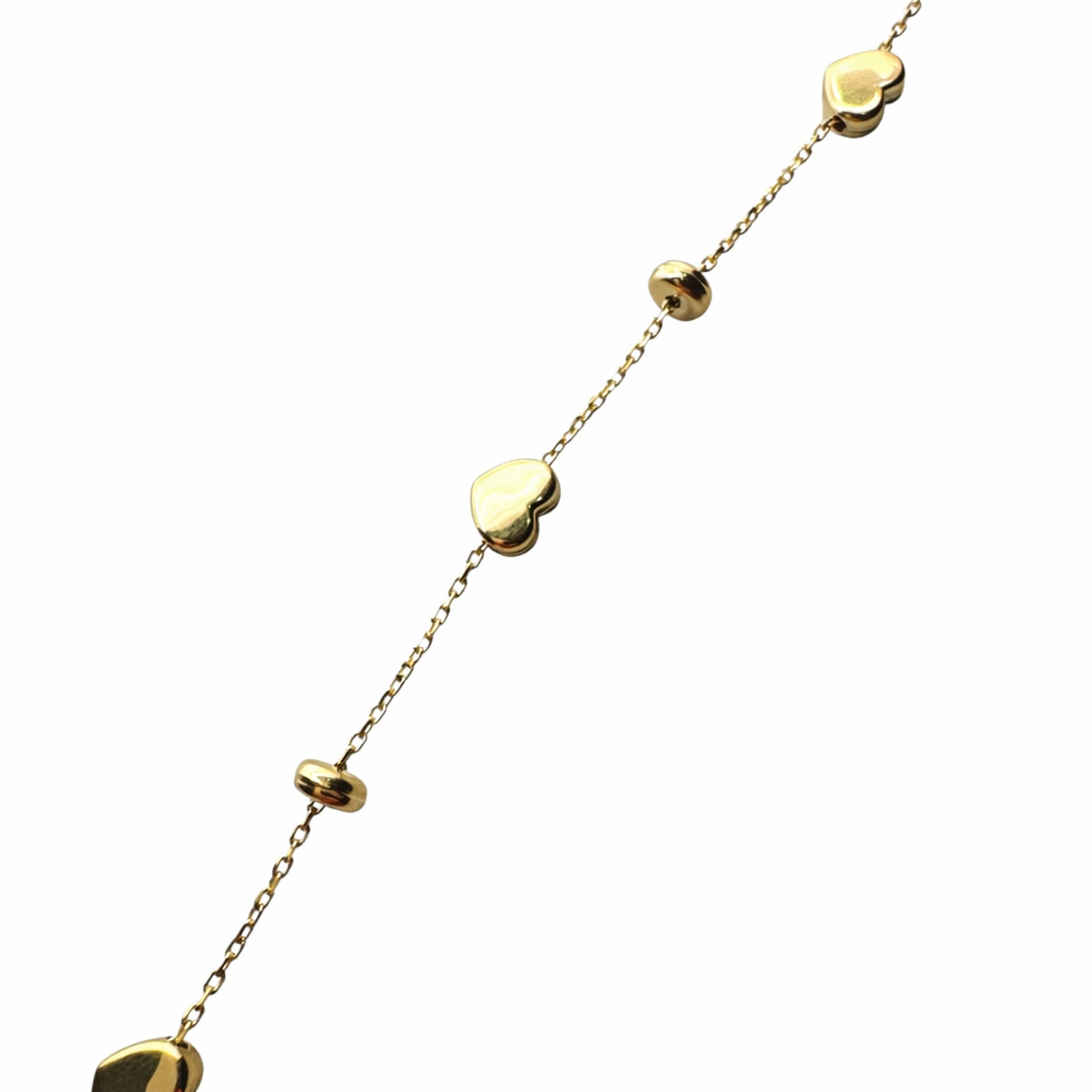 Pulsera de corazones en oro 10K de Joyería ROMA, con diseño de corazones entrelazados y acabado brillante.