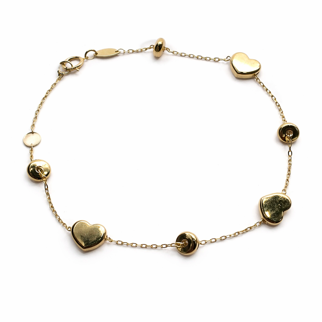 Pulsera de corazones en oro 10K de Joyería ROMA, diseño delicado con detalles en forma de corazones.