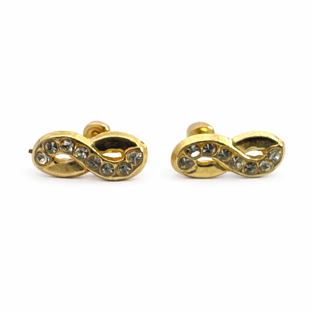 Broquel infinito de oro 10K con zirconias, diseño elegante y brillante de joyería ROMA, en color dorado con detalles de zirconia.