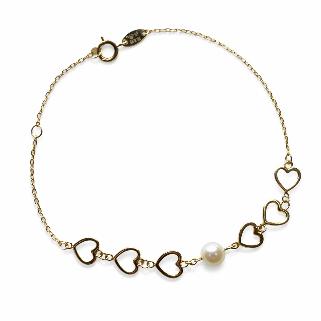 Pulsera de corazones con perla en oro 10K, joyería ROMA, diseño delicado y elegante para ocasiones especiales.