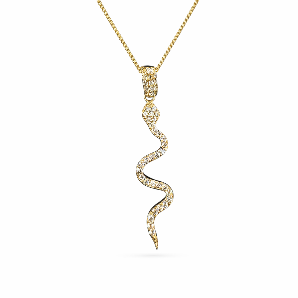 Serpiente de joyería en oro 10K con zirconias, diseño elegante y detallado, marca Joyería ROMA.