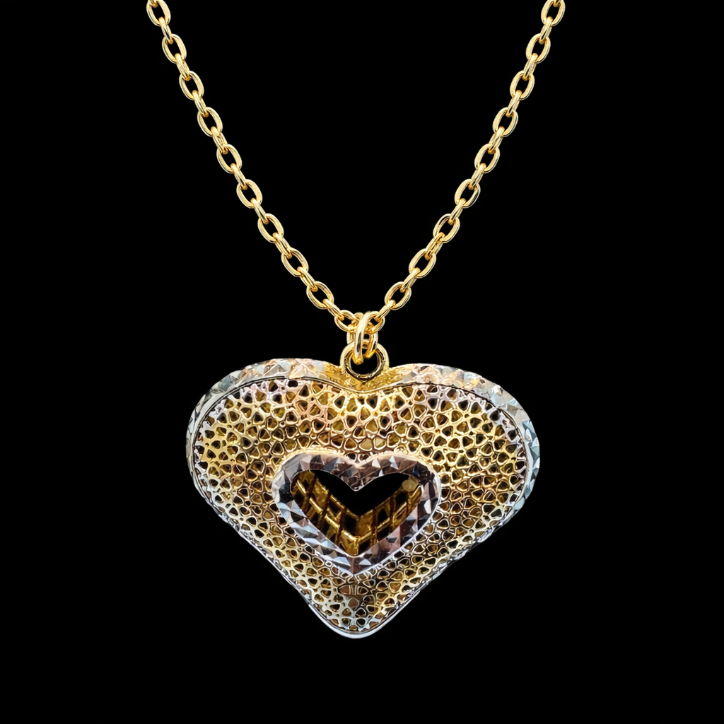 Gargantilla corazón 3D bicolor en oro 10K de Joyería ROMA, con diseño de corazón tridimensional y acabado en dos tonos.