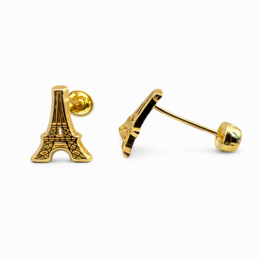 Broquel en oro 10K con diseño de la Torre Eiffel, joyería ROMA, mostrando detalles de la figura y acabado brillante.
