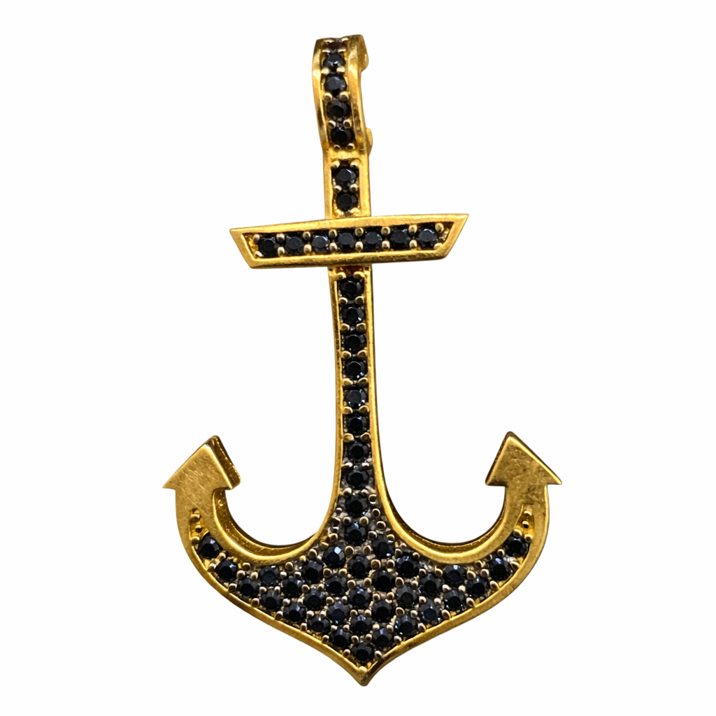 Ancla con zirconias negras en oro de 10K, joyería elegante y moderna con detalles brillantes y diseño náutico.