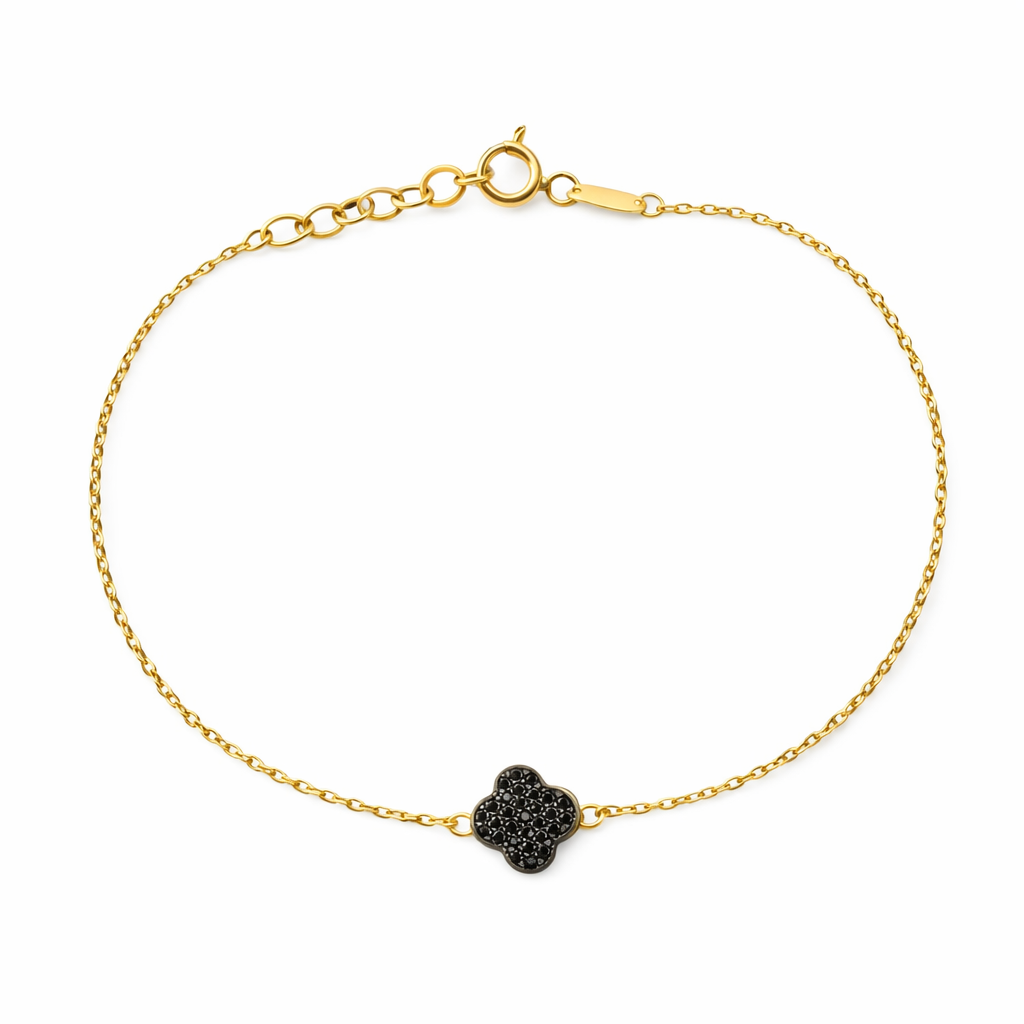 Pulsera de trébol en oro 10K con zirconias negras, joyería elegante y delicada, diseñada por Joyería ROMA.
