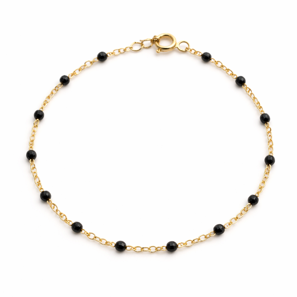 Pulsera Mini Bolitas Negras en oro 10K de Joyería ROMA, mostrando las pequeñas bolitas negras en una elegante pulsera.