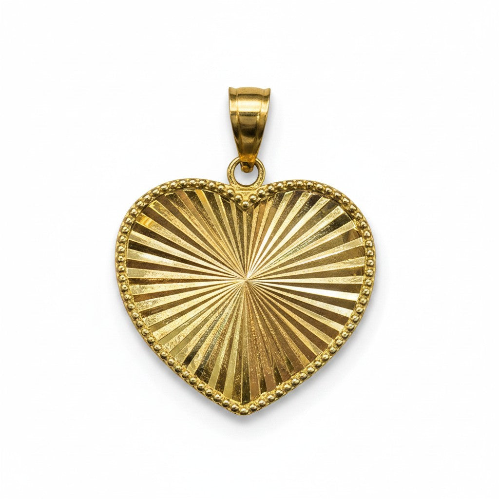 Dije corazón facetado en oro de 10K con acabado brillante, joyería elegante de Joyería ROMA.