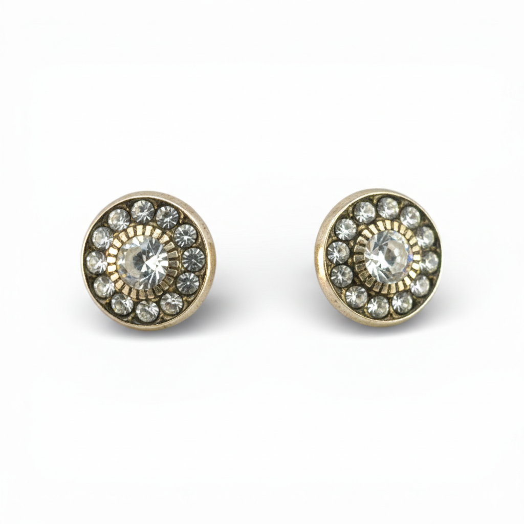 Broquel tipo giratiempo de oro 10K con zirconias, joyería Roma, muestra detalles en oro y piedras brillantes en la imagen.
