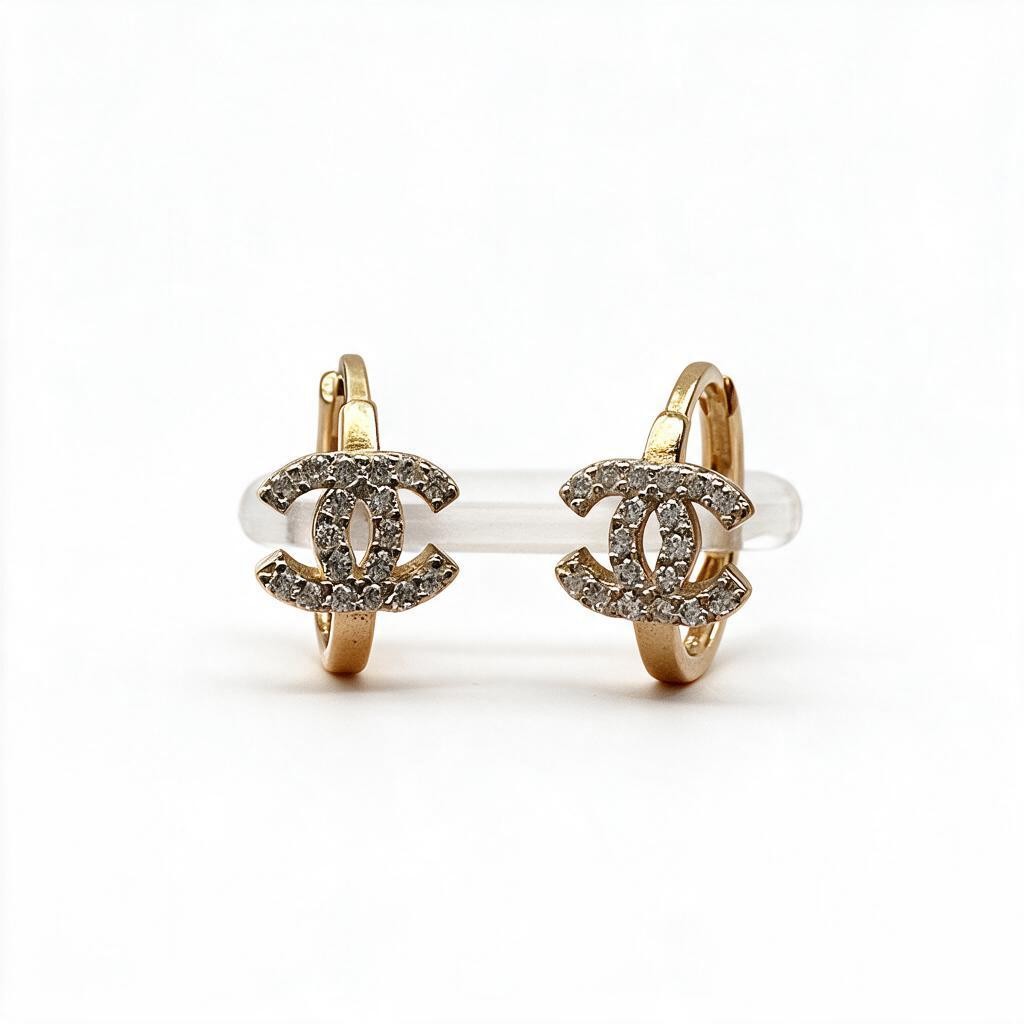 Aretes Huggie con Moño de Zirconias - Oro 10K