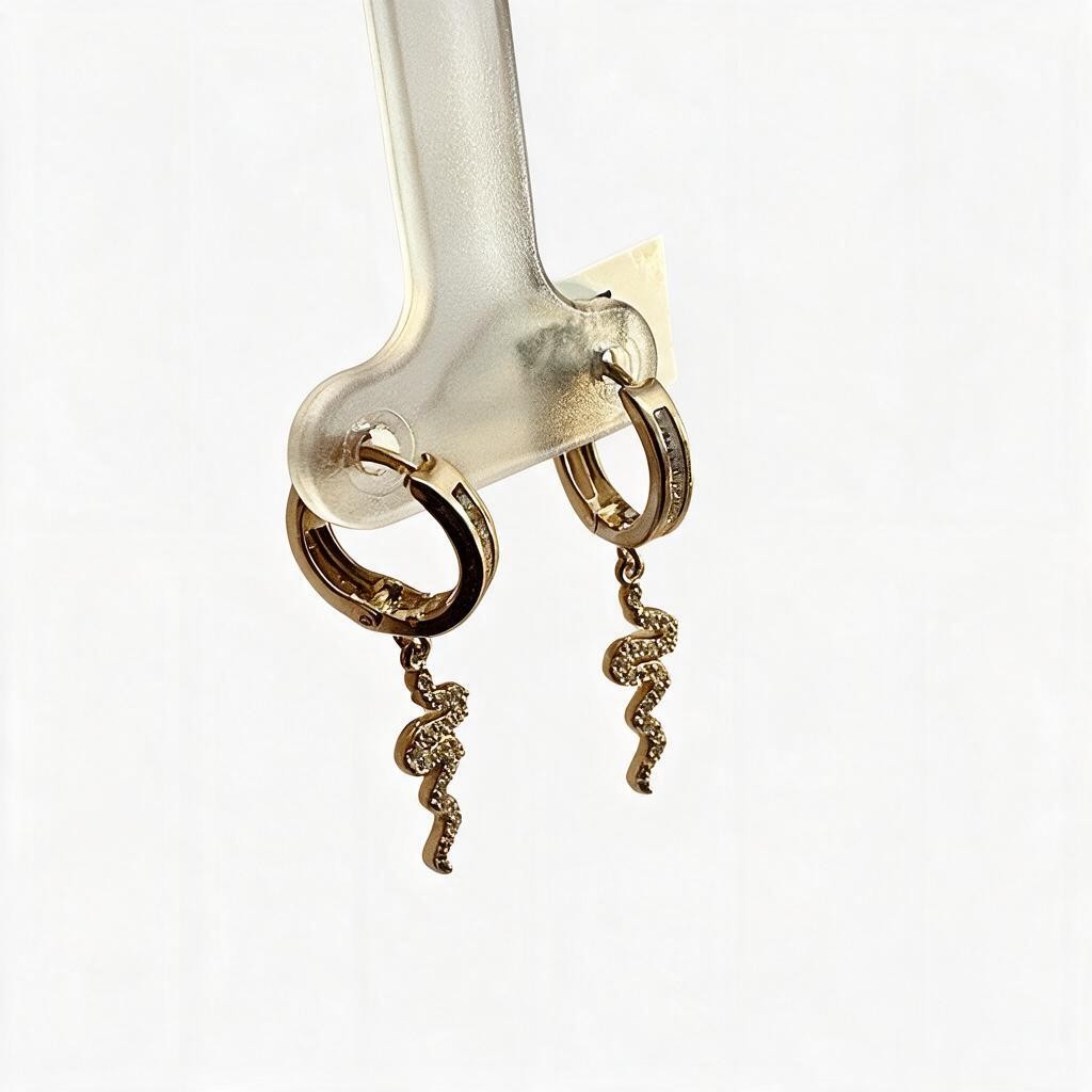 Aretes Huggie con Serpiente - Oro 10K