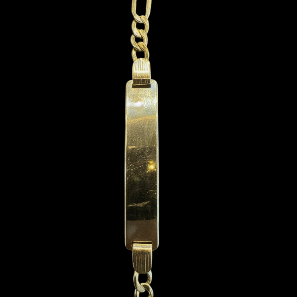 Esclava clásica de joyería ROMA en oro de 10 quilates, diseño elegante y fino, sobre fondo neutro.