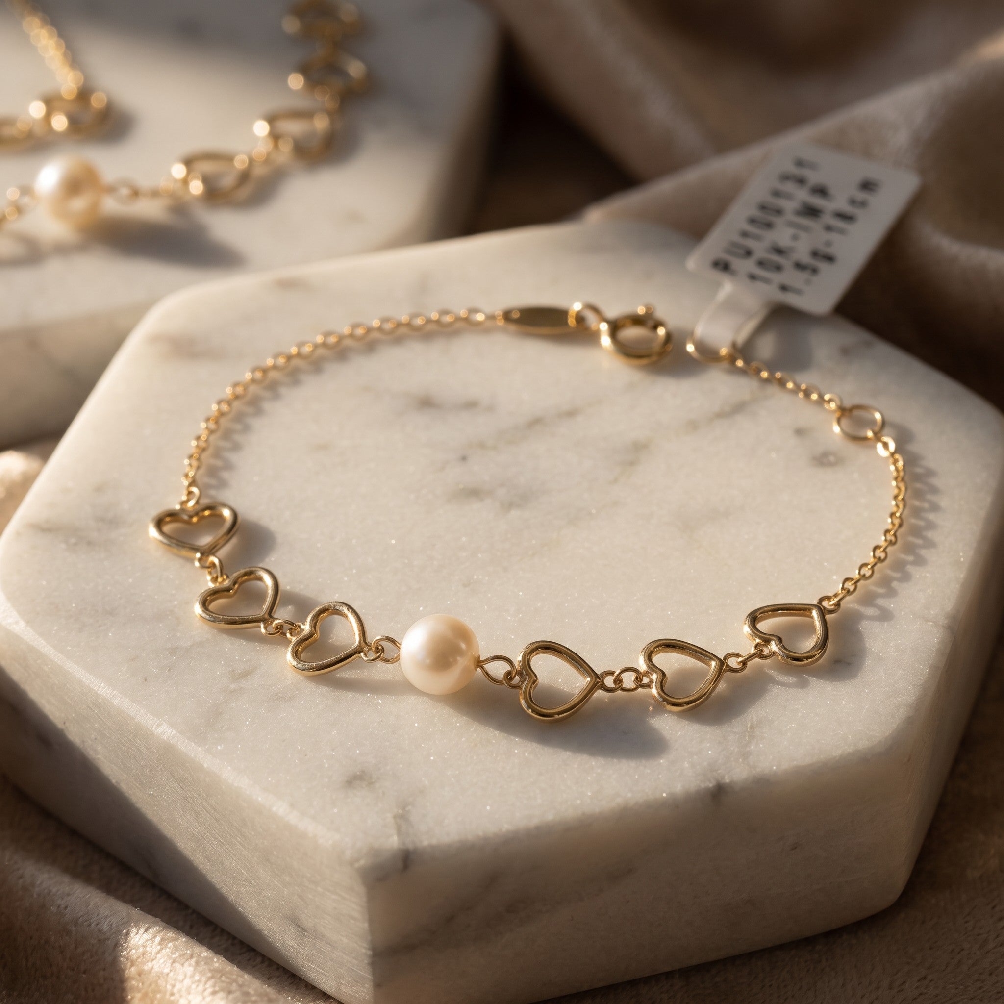 Pulsera Corazones con Perla de Oro 10K